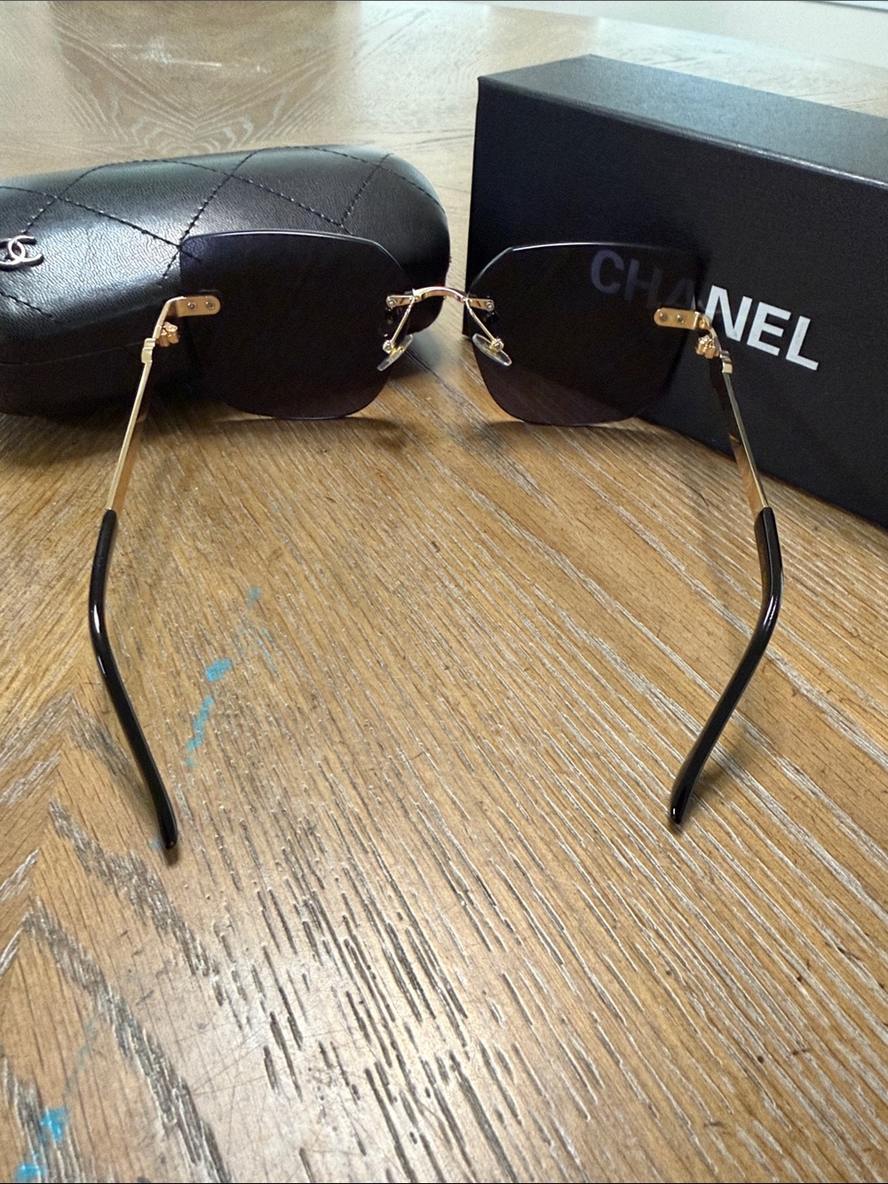 CHANEL Black Rimless Square Sunglasses with Gold Accents - Picture 7 of 9